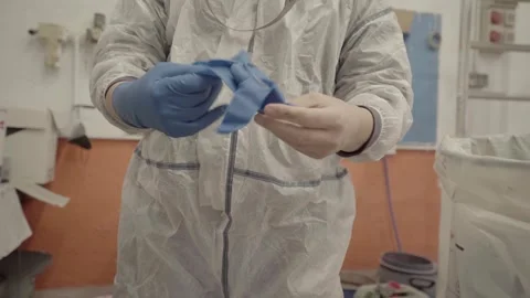Car painter puts on blue nitrile gloves to work 스톡 동영상 241503268