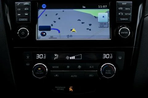 The car panel. A built computer screen with a navigator and a separate climate Stock Photos