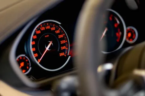 Car panel instrument red speedometer and tachometer Stock Photos