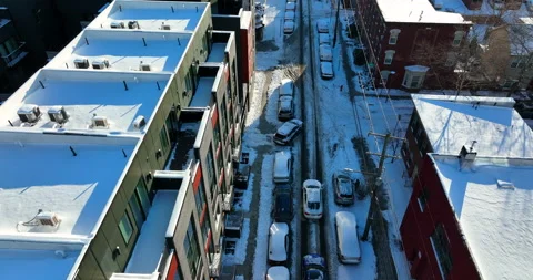 Car parallel parks in winter snow. Tight urban American street. Snowy Stock Footage 170835908