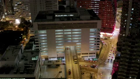 Car Park Building with a unique flyover crossing the building in Hong Kong Stock Footage 144594943