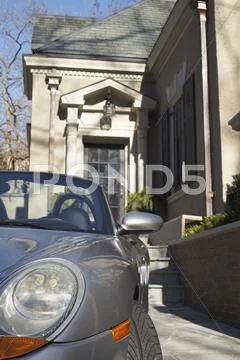 Car Parked In Driveway