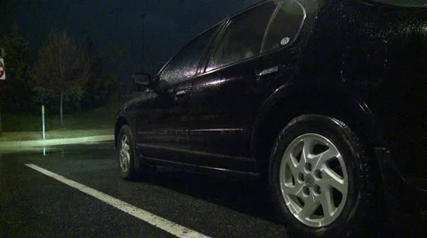 Car parked in the rain (5) Stock Footage 2677607