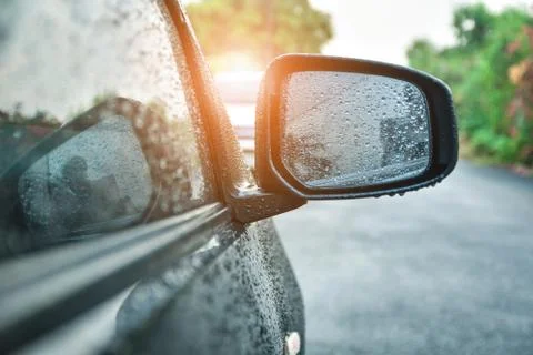 Car parked on road when raining, mirror wiper driver Stock Photos