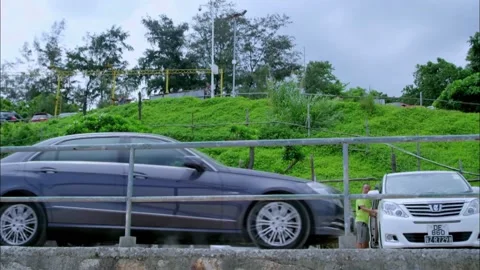 A car parking in front of the camera Stock Footage 235268151