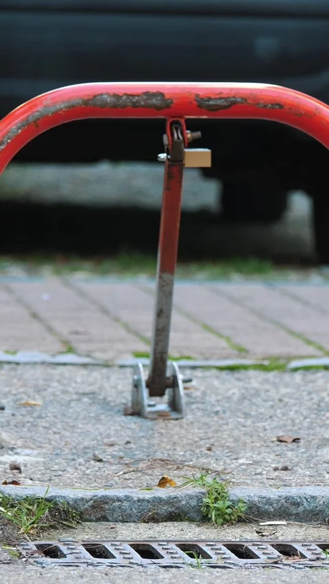 Car parking lock device. Manual car parking barrier with lock and stop sign. 動画素材 310565092