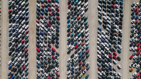 Car parking lot filled with various vehicles showcasing different colors and Stock Footage 321256792