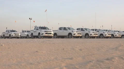 Car parking in the row of same toyota car in desert Video stock 144799613