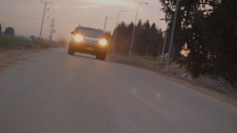 Car pasd by in sunset Stock-Footage 93877532