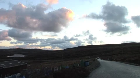 Car Passes Camera On Hill Stock Footage 4259683