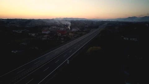 A car passes on a deserted highway Stock Footage 126406587