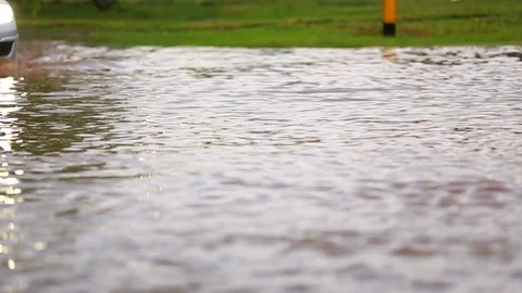 The car passes a flooded section of the road Stock Footage 85293152