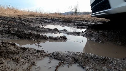 The car passes through the mud Stock Footage 125916113