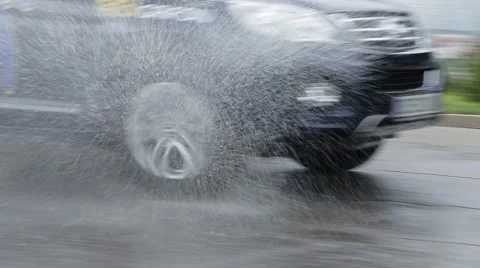 Car passes through a puddle Stock Footage 52208454