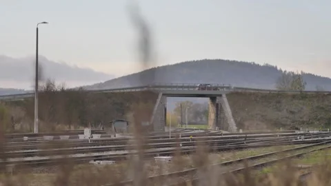 The car passes through two railway viaducts Stock Footage 244739567