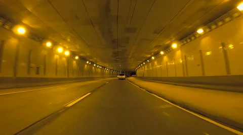 Car Passes While Driving Down Tunnel Vídeos de archivo 58953729