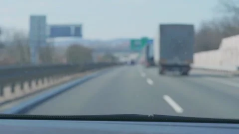Car passing and bend right to exit ramp of highway at day Stock Footage 136190688