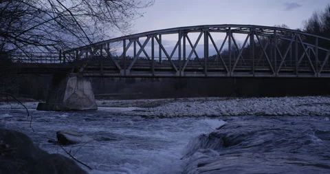 Car passing a bridge over mountain river. Video stock 147634373