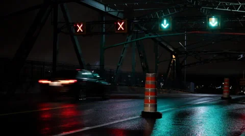 CAR PASSING ON A BRIDGE, RAIN, NIGHT, LIGHT, SIGNS Stock Footage 40863580