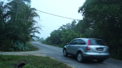 A Car Passing By On Cornering Road In Quiet Rural Area Stock Footage 34632947