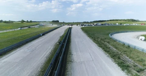 Car passing by dynamically drone shot Stock Footage 89416335