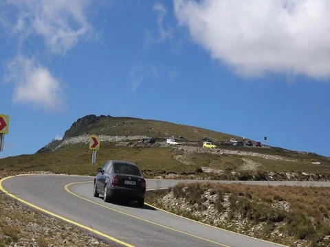 Car passing in high mountain road Transalpina at summer stock footage Stock Footage 70960254