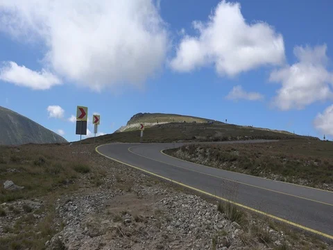 Car passing in high mountain road Transalpina at summer speed motion Video stock 70960619