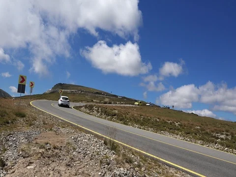 Car passing in high mountain road Transalpina at summer Stock Footage 70960630
