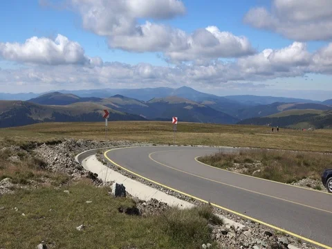 Car passing in high mountain road Transalpina speed motion Stock-Footage 70960667