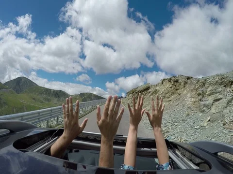Car passing in high mountain road at summer. Stock Footage 72392542