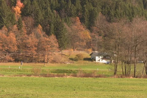 Car passing house Stock Footage 1050644