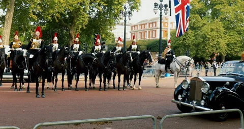 Car passing with King Charles and Queen Camilla, en route to Buckingham Pal.. Stock Footage 240093419