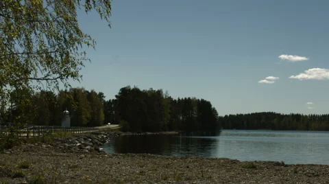 Car passing by lake on a bridge Stock Footage 49103221