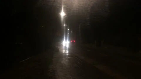 Car passing at night Stock Footage 166826160