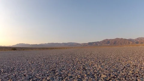 Car passing over camera in Nevada desert Stock Footage 95487799
