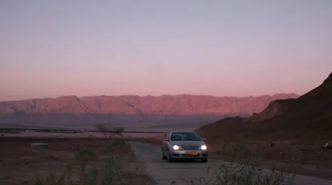 Car passing at a red desert Video stock 58234982