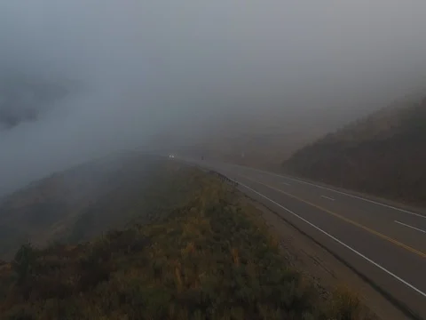 Car passing in thick fog from the side of the road. Stock Footage 80676425