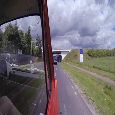 Car passing through the bridge while moving on the country road Stock Footage 69494135