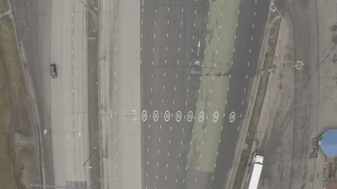 Car passing tool gate on Russian highway, drone view Stock Footage 148374631