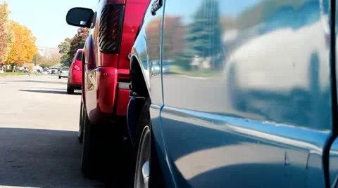 Car passing by two trucks 動画素材 12364382