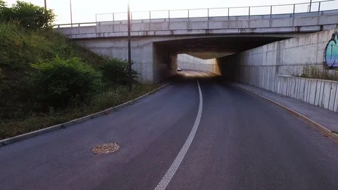 Car passing under the bridge Stock Footage 71568181