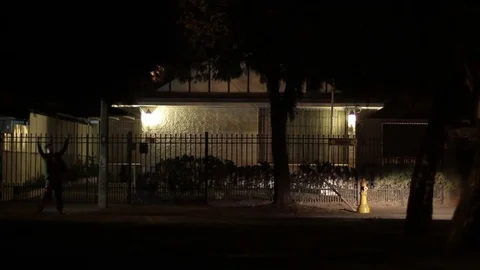 Car picking up passenger at night Stock Footage 77045926