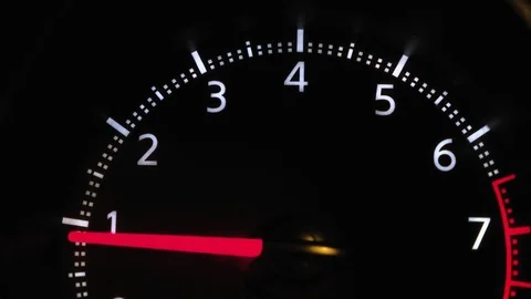 The car pics up speed, the load on the engine, tachometer Stock Footage