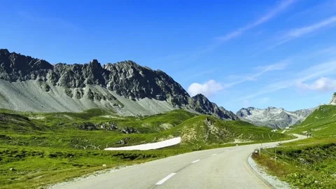 Car Point of View on a Beautiful Mountain Road with Two on Bicycle with Mountain Stock Footage 315248954
