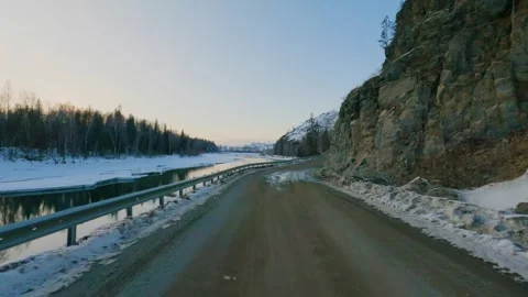Car point of view driving along mountain river road in winter Stock-Footage 346636286
