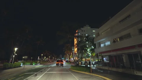 Car point of view driving on Ocean Drive in Miami Beach, Florida at night Stock Footage 319052948