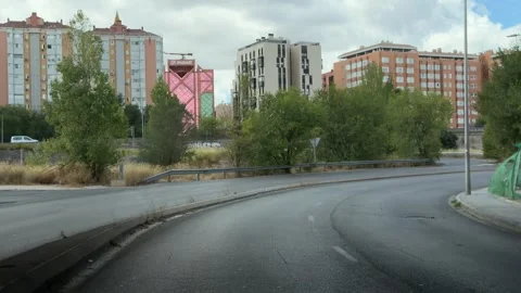 Car point of view driving under a bridge in the city outskirts Vídeo Stock 344572009