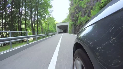 Car Point of View on Mountain Road and a Tunnel Stockbeeldmateriaal 135564500