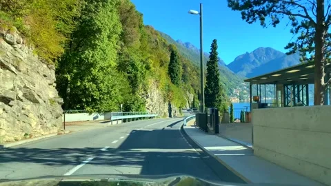 Car Point of View on Mountain Road with Alpine Lake Lugano in a Sunny Day Stock-Footage 165201352