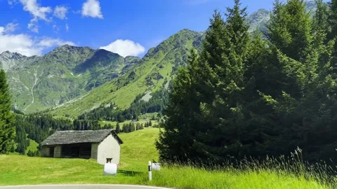 Car Point of View over Beautiful Mountain Road Pass with swiss Alps Stock Footage 292980672
